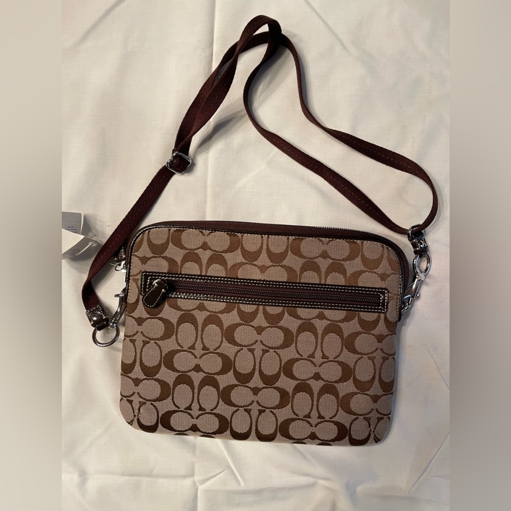 Coach tan with brown trim crossbody bag.